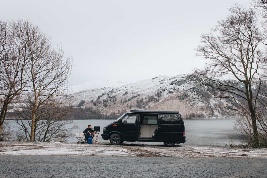 Man sitting near van